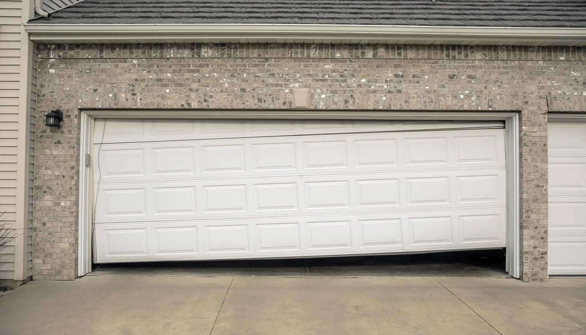 Damaged Garage Door Replace or Repair